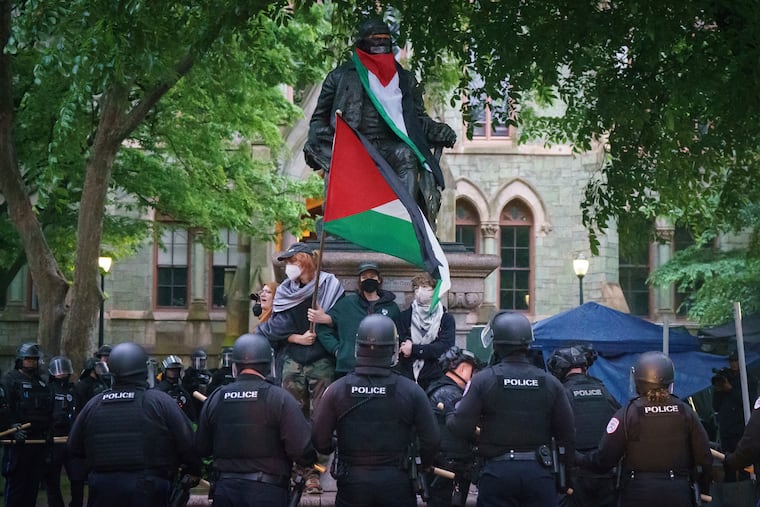 Police confront protesters at the University of Pennsylvania campus on Friday. The pro-Palestinian encampment that had been there for 16 days was dismantled.