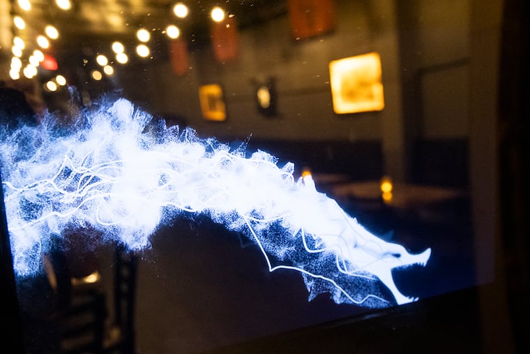 An animated dragon on the street level of Far East Descendant in Chinatown.