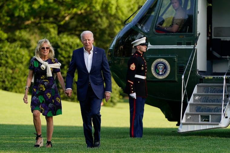 President Joe Biden and first lady Jill Biden walk on the South Lawn of the White House after stepping off Marine One, Sunday, June 27, 2021, in Washington.