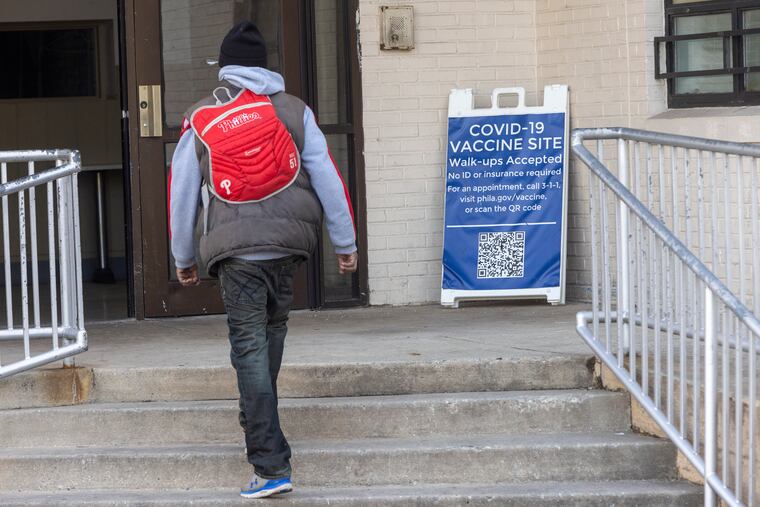 A person arrives at the Community Center of Salvation Army facility at 55th and Market Streets to get vaccinated at a city of Philadelphia COVID-19 clinic.