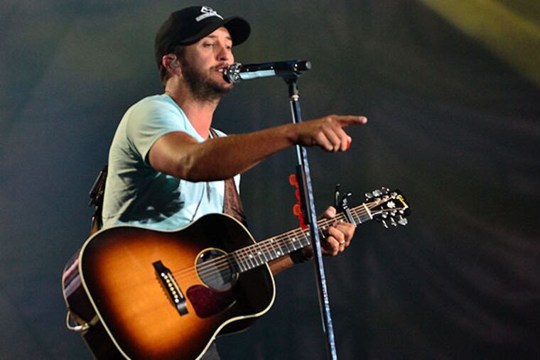 Country singer Luke Bryan performs to a sold out crowd at Lincoln Financial Field on Friday, Aug. 15, 2014. (C.F. Sanchez / Staff Photographer)
