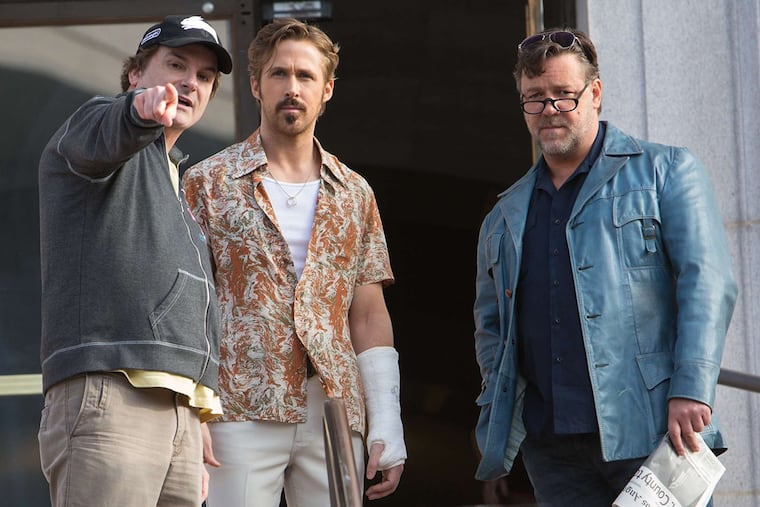Writer-director Shane Black (left) with "The Nice Guys" stars, Ryan Gosling and Russell Crowe (right). The script by Black and writing partner Anthony Bagarozzi kicked around Hollywood for more than 12 years. "And then," says Black, "I did a film, 'Iron Man 3.' Suddenly, everybody was interested."