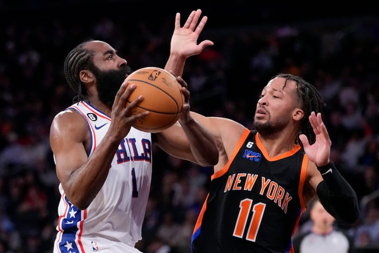 Philadelphia 76ers guard James Harden (1) shoots against New York Knicks guard Jalen Brunson (11) during the first half of an NBA basketball game, Sunday, Feb. 5, 2023, in New York. (AP Photo/John Minchillo)