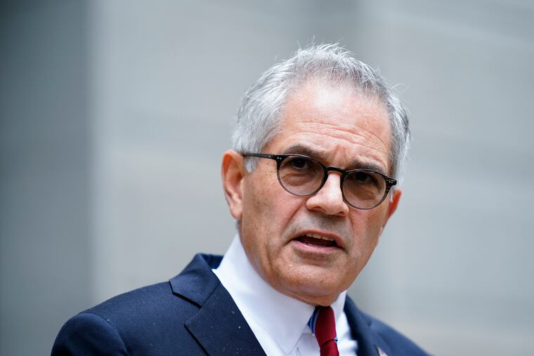 Philadelphia District Attorney Larry Krasner speaks with reporters.