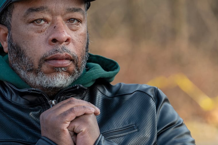 Stanley Kee is photographed near the location where his mother was recently killed in a hit and run after getting off of a bus stop in Philadelphia, Pa.
