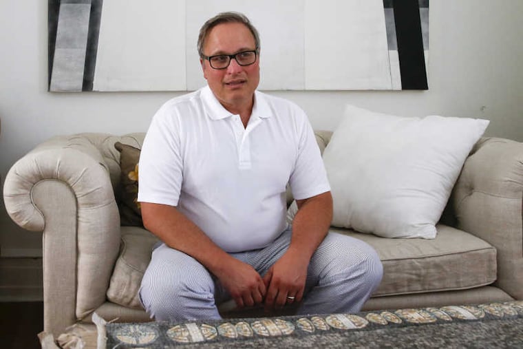 Peter Klenk in his Center City home on Friday, August 18, 2017. Klenk, a estate-planning attorney, used Ancestry.com and discovered a half-brother.