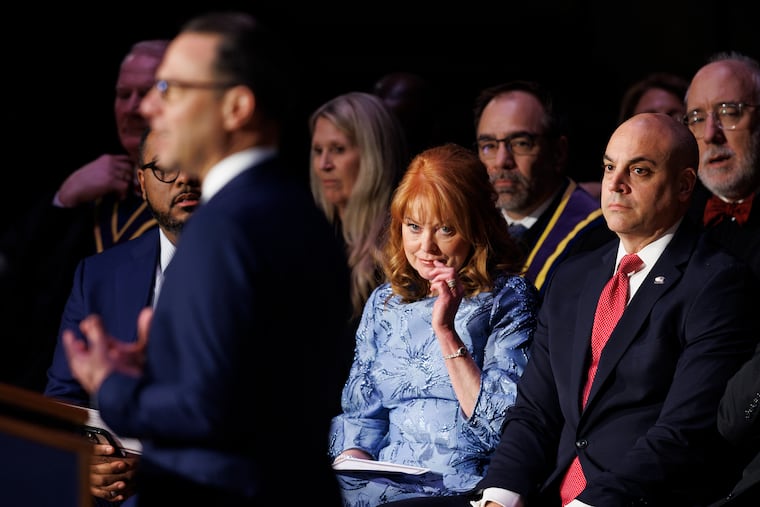 Pennsylvania Treasurer Stacy Garrity and Pennsylvania Attorney General Dave W. Sunday listen to a speech by Gov. Josh Shapiro at the Forum Auditorium in Harrisburg in January.