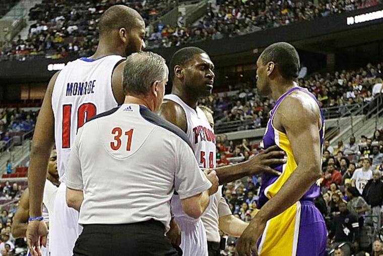 On Sunday, Lakers forward Metta World Peace received a flagrant foul after mixing it up with Pistons guard Brandon Knight. (Carlos Osorio/AP)