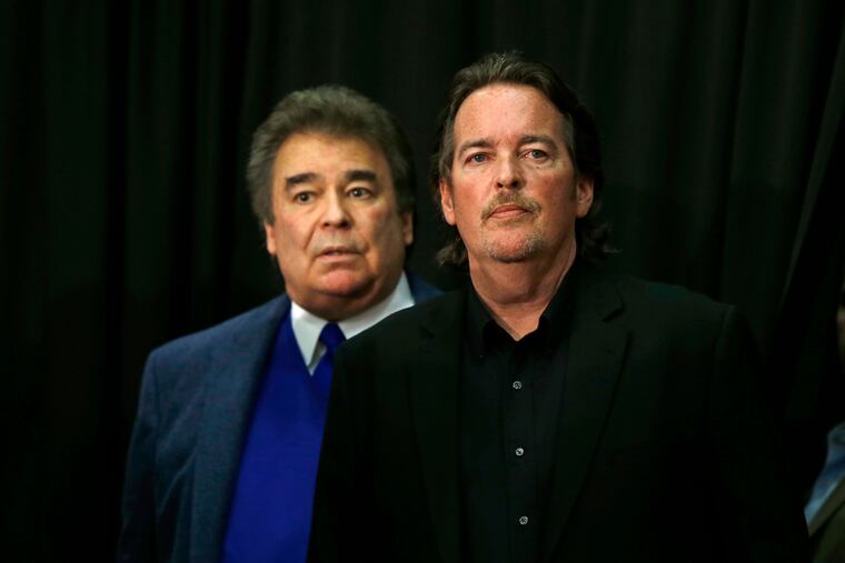 FILE- In this April 22, 2016 file photo, Democratic presidential candidate Hillary Clinton's brothers Tony Rodham, right, and Hugh Rodham, stand before she speaks at a campaign stop in Dunmore, Pa. The former U.S. Senator, Secretary of State, First Lady and Democratic presidential candidate announced Saturday, June 8, 2019 on Twitter her youngest brother Tony Rodham died Friday. Clinton remembered him as a kind and generous person who could walk into a room and “light it up with laughter." She didn’t say how he died but said Rodham was survived by his wife, Megan, and three children.