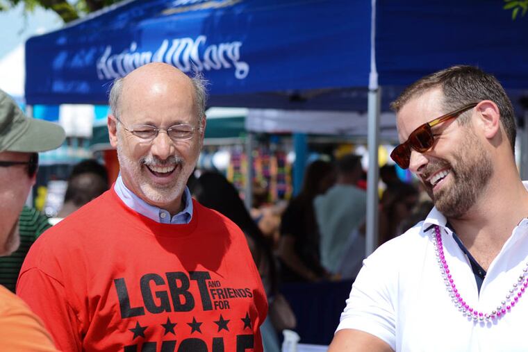 Democratic governor candidate Tom Wolf, left, and Pennsylvania State Representative Brian Sims, right, shake hands while attending PrideDay at Penns Landing on Sunday, June 8, 2014. Andrew Thayer / Staff Photographer
