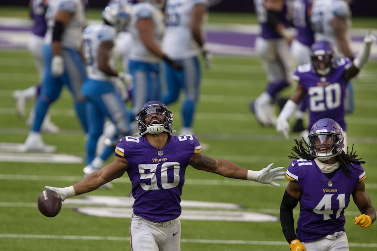 Eric Wilson celebrates an interception against the Lions.