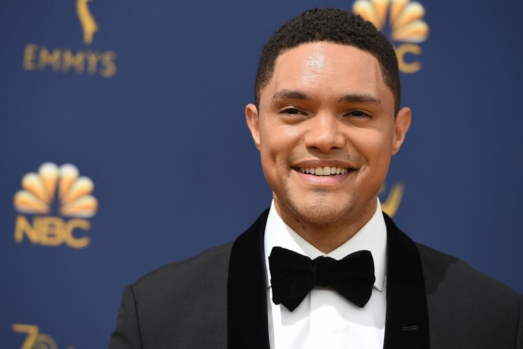 FILE- In this Sept. 17, 2018, file photo, Trevor Noah arrives at the 70th Primetime Emmy Awards at the Microsoft Theater in Los Angeles. Trevor Noah appeared as usual on “The Daily Show,” but his voice didn’t. The host relied on fellow Comedy Central correspondents to read his monologue, instead. It’s unclear how long he will be unable to speak or what caused the problem. (Photo by Jordan Strauss/Invision/AP, File)