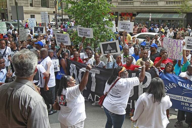 Aid program's end protested
Protesters, including Jessie Bowden Jr. (right) of North Philly, gather Tuesday at the Bellevue hotel, where Gov. Corbett's local office is housed, a day before the state General Assistance program is set to end. Corbett proposed eliminating the program, which assists 70,000 vulnerable residents, to save about $150 million.
Photos: Akira Suwa / Staff Photographer