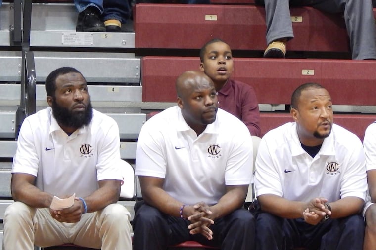 Jazz Williams (center) coached West Catholic's boys' basketball team from 2014-16.