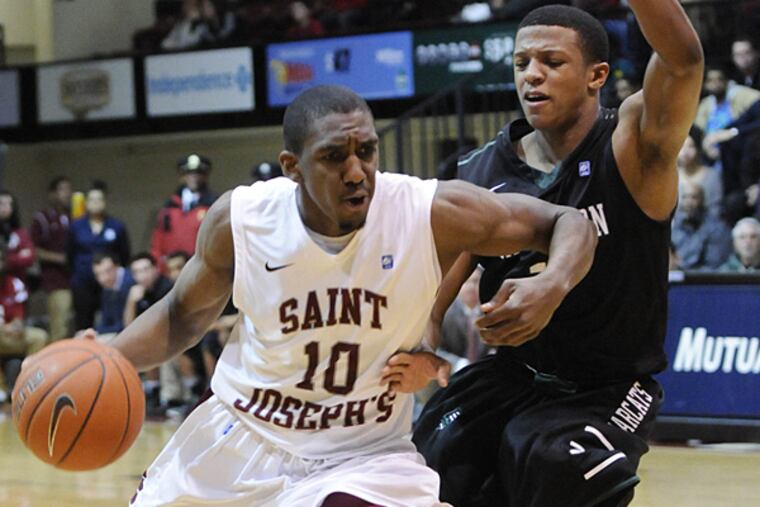 St. Joe's guard Langston Galloway drives around Binghamton's Marlon Beck II in the second half on Tuesday. (Ron Tarver/Staff Photographer)
