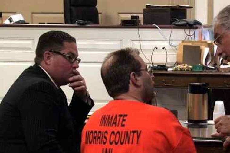 Nicodemo S. Scarfo, in Morris County Superior Court, talks with a lawyer.