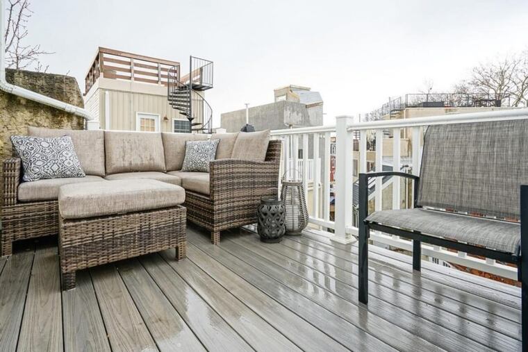 The owners of a rowhouse in Philadelphia’s Graduate Hospital neighborhood say they love the outdoor spaces — a roof deck and a back patio.