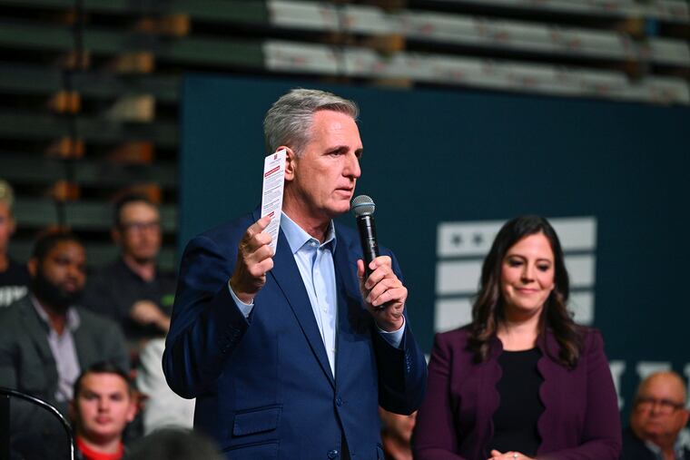 House minority leader Kevin McCarthy, R-Calif., speaks as Rep. Elise Stefanik (right), R-N.Y., listens at DMI Companies in Monongahela, Pa., on Friday.