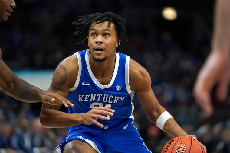 Camden product and Kentucky guard DJ Wagner handles the ball during the first half of a game against Kansas. His status for this weekend's game against Penn remains up in the air.