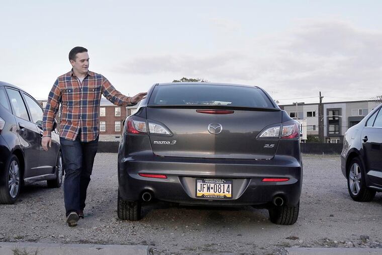 "Hopefully it will still be here tomorrow," says Kevin Ricker as walks away from his 2010 Mazda 3 after it was towed away and then towed back to the Piazza at Schmidts on October 30, 2014. ( ELIZABETH ROBERTSON / Staff Photographer )