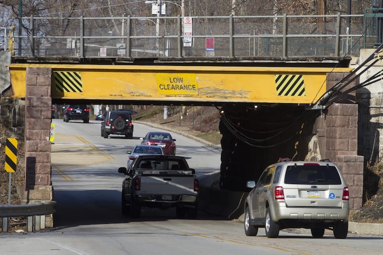 Motorists drive though the King of Prussia road bridge, located near the Radnor Train Station in Radnor, Pa. Wednesday, December 27, 2017. There have been many accidents involving trucks not clearing the bridge.