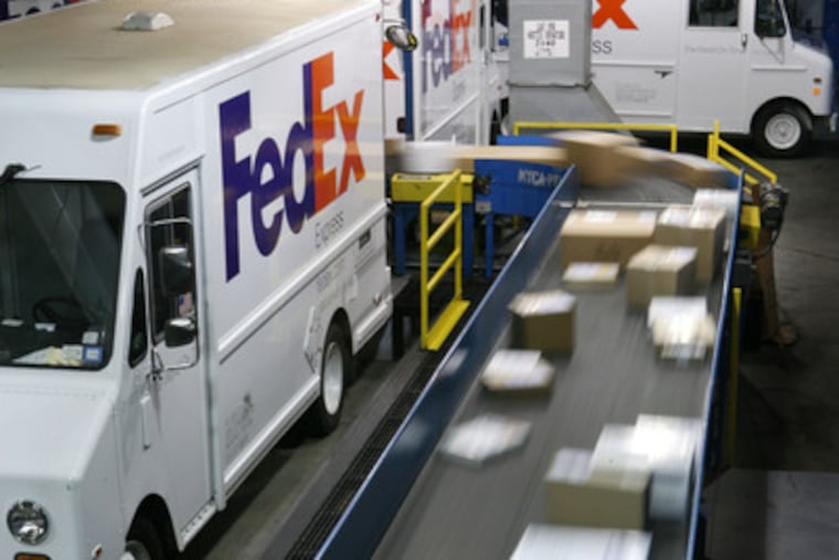 Packages pass along a conveyor belt before being loaded onto delivery trucks at the FedEx Express Station in New York. FedEx, the package-delivery company, which is based in Memphis, had its busiest day of the year yesterday.