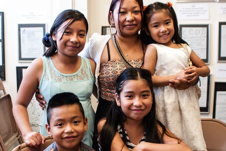 Blanca Bautista (second from right, rear) and her children (clockwise from left), Diana, Abril, Estefani, and Jose Manuel, hope for the release of Jose Manuel Benito de Castilla, who was arrested during a search for someone else. MATTHEW HALL / Staff Photographer