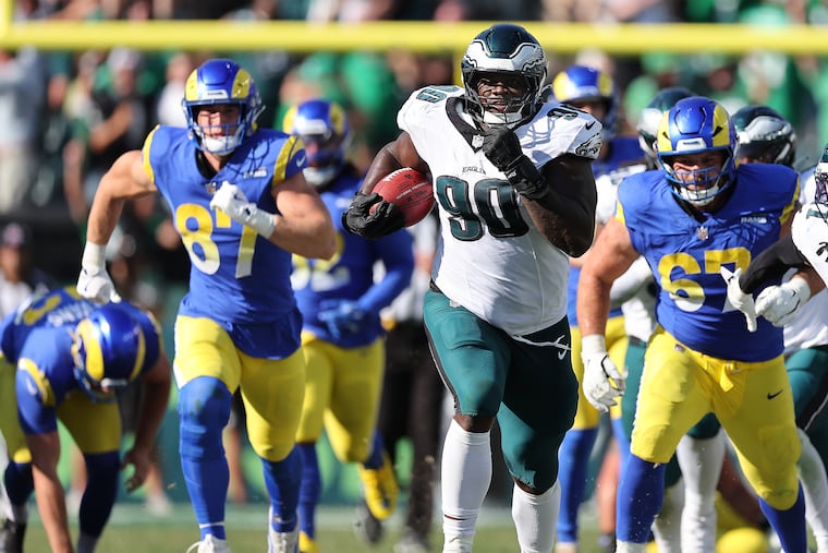 Eagles defensive tackle Jordan Davis returns a game-winning blocked field goal for a touchdown against the Los Angeles Rams. The Eagles overcame a 19-point deficit to win, 33-26.