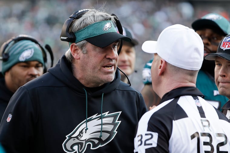 Eagles coach Doug Pederson arguing with referee John Parry during a game against the Houston Texans last season.