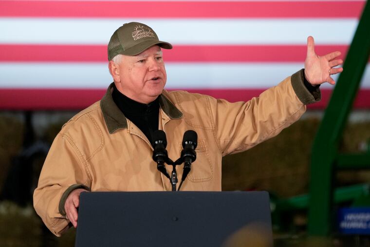 Minnesota Gov. Tim Walz, announced Tuesday as Kamala Harris' running mate, speaks before President Joe Biden at Dutch Creek Farms in Northfield, Minn., in 2023.