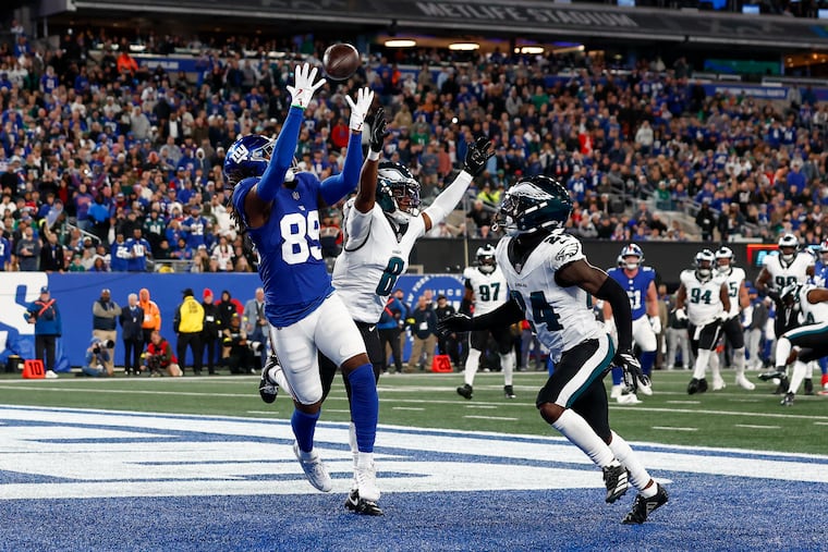 Eagles cornerback Adoree' Jackson (8) and safety Drew Mukuba break up a pass intended for the Giants' Lil'Jordan Humphrey on Thursday.