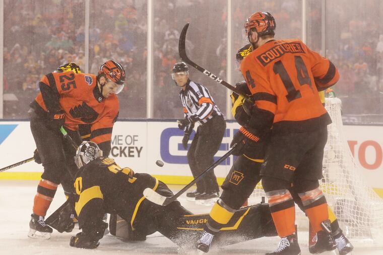 Flyers left winger James van Riemsdyk (25) scores against Pittsburgh goaltender Matt Murray as his team rallied for a dramatic 4-3 overtime win at Lincoln Financial Field on Feb. 23.