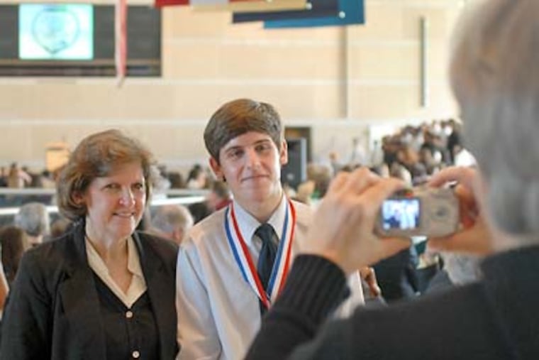 Inquirer Student Citizenship Award winner Robert Verderame, of Abington High School, poses for a photo with his mother Catherine McShea (right) following the recognition breakfast at the National Constitution Center on Thursday. (Tom Gralish / Staff Photographer)