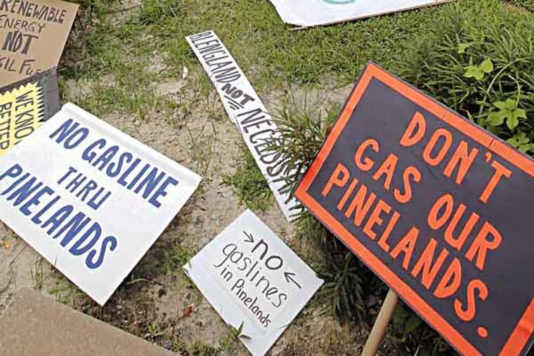 Protest signs lay at the NJ Pinelands Commission office ground while hearing is going on inside. July 26, 2013( AKIRA SUWA / Staff Photographer )