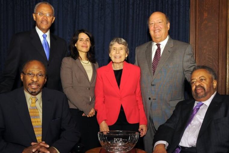 Journalists Acel Moore (left) and Claude A. Lewis (right) received the M. Powell Lawton Quality of Life Award from the Philadelphia Corporation for Aging. Standing from left: Rodney D. Williams; Lawton's daughter, Pamela, and widow, Faye, and Herb Cutler.