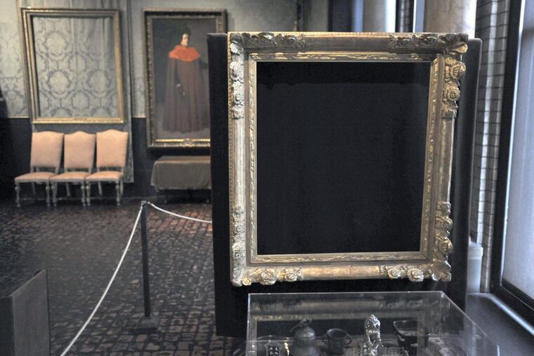 In this 2010 photo, empty frames from which thieves took "Storm on the Sea of Galilee," left rear, by Rembrandt and "The Concert," right foreground, by Vermeer, remain on display at the Isabella Stewart Gardner Museum in Boston. Midnight Dec. 31, 2017, is the deadline to collect a doubled reward being offered for information leading to the recovery of 13 works worth an estimated $500 million.