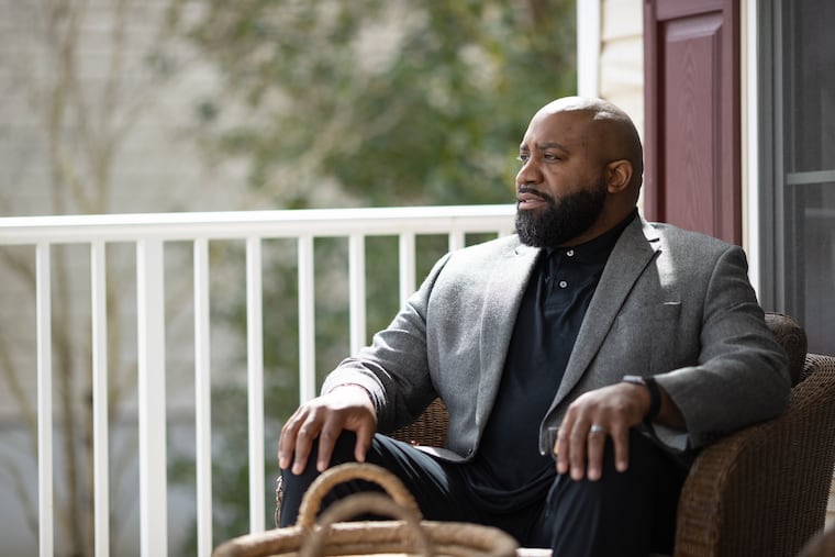 Darrell Edmonds sits outside his home in Mays Landing, N.J.His mentoring group, Friday Is Tie Day, has gone virtual because of the pandemic.