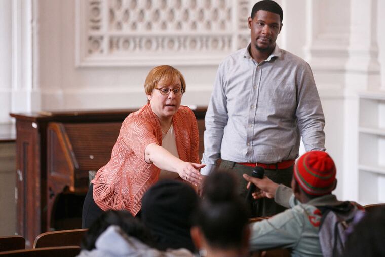 Shira Goodman and Michael Cogbil talk with students at Cooke Middle School about gun violence.