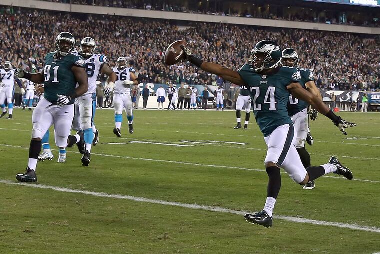 Eagles' Bradley Fletcher scores a second-quarter interception
touchdown against the Panthers.