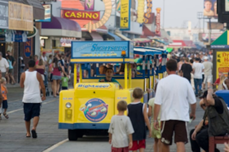 The popular tram makes its way down Wildwood's boardwalk. The three Wildwoods have wide, wide beaches and lots of boardwalk for a backdrop.