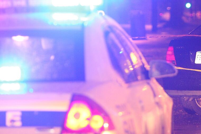 Police scene – Steven M. Falk / Staff Photographer