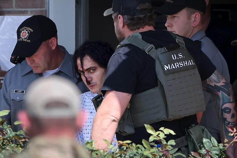 Danilo Cavalcante is escorted from the Pennsylvania State Police barracks in Avondale, Pa. on Sept. 13.
