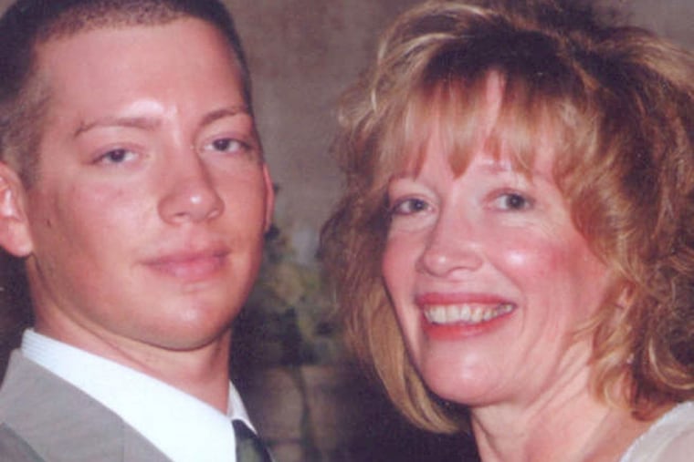 Michael John Fox with his mother, Diane. He was beaten to death in his bedroom in Bella Vista in 2012, a case that remains unsolved.
