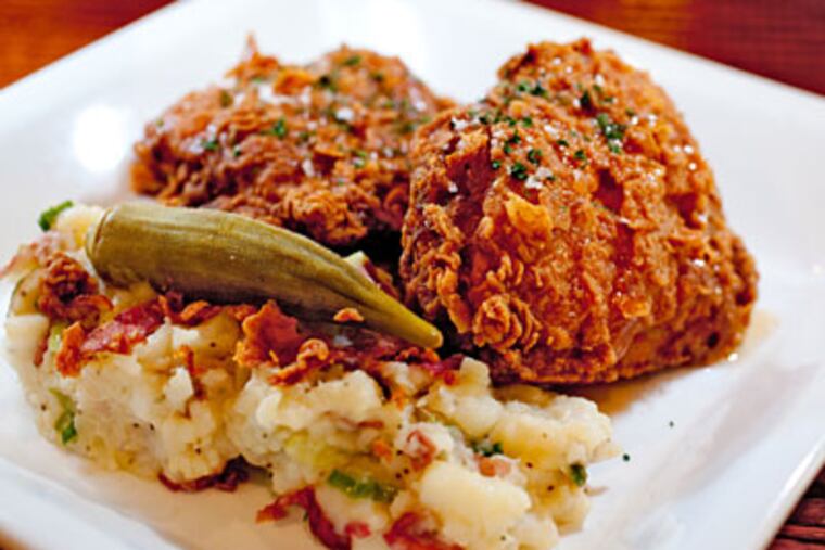 Resurrection's twice-fried chicken with spiced honey graces Bon Appétit this month. And that potato salad's just the kind of super serendipitous side that pops up on the fried-chicken trail. (DAVID M WARREN / Staff Photographer)