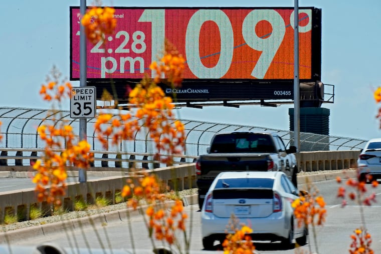 A digital billboard displays an unofficial temperature July 17 in downtown Phoenix.