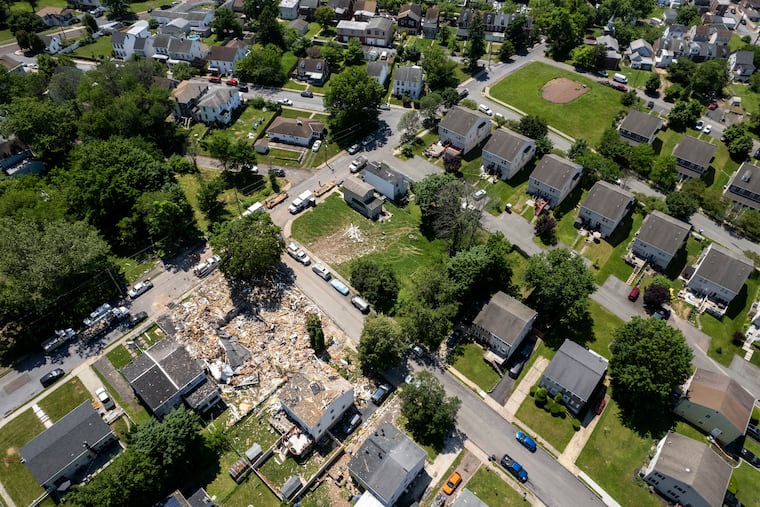 Debris covers the site of an explosion at the corners of Butler Avenue and Hale Street in Pottstown, Pa. on Tuesday, May 31, 2022. Five people were killed in the explosion last Thursday, four children and one adult. As of Tuesday morning, the source and origin point of the explosion had not been released.