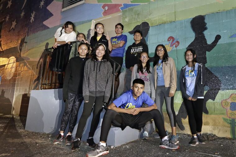 "I Run This City: Camden, NJ" St. Anthony Chapter team photo of their 8K and half marathon runners who are under the guidance of Luis Gaitan (top of photo in middle).