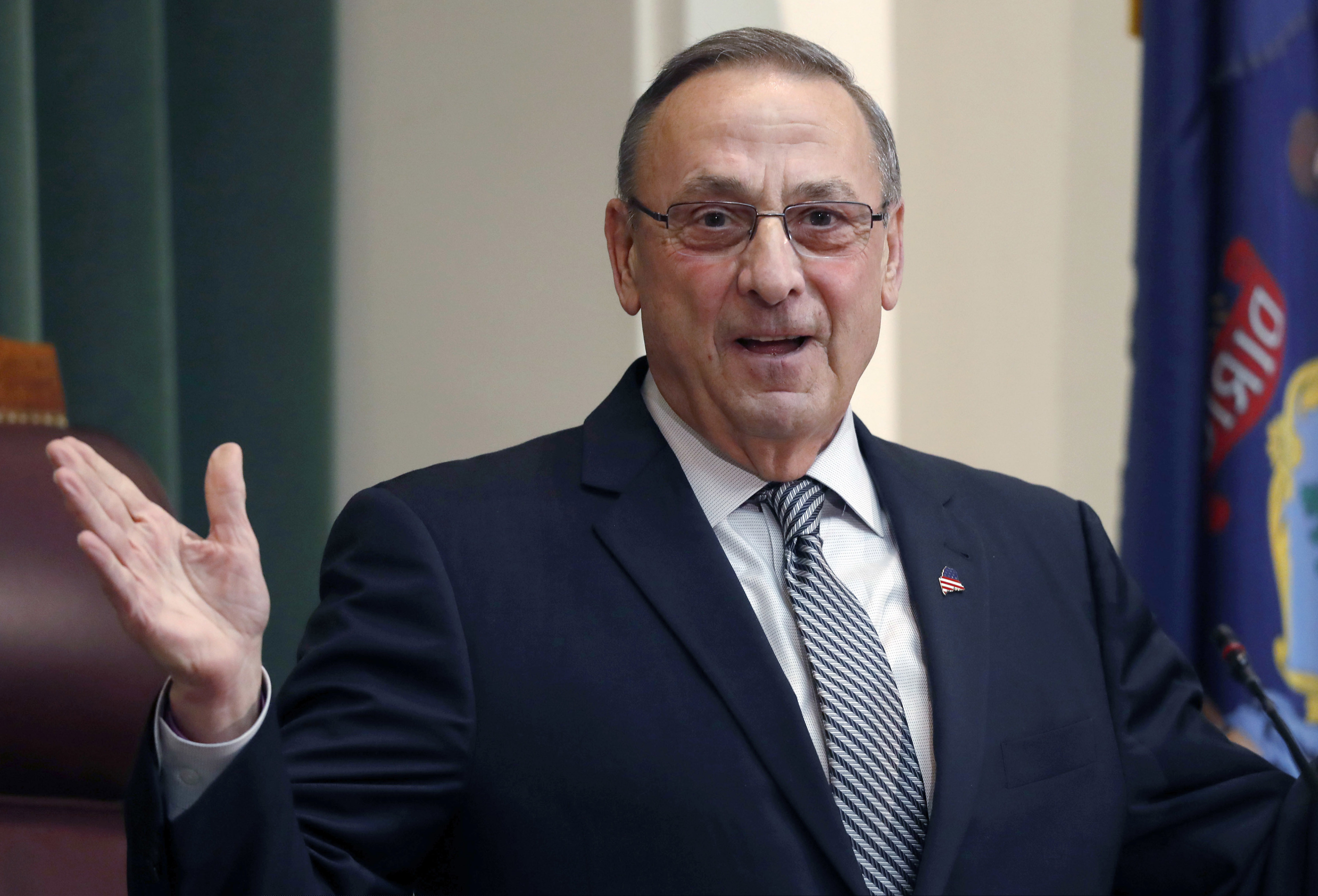 FILE - In this Feb. 13, 2018, file photo, Gov. Paul LePage delivers the State of the State address to the Legislature at the State House in Augusta, Maine. Maine’s corrections department says that the former governor pardoned two people in his last days in office without consulting the clemency board and holding a public hearing. (AP Photo/Robert F. Bukaty, File)