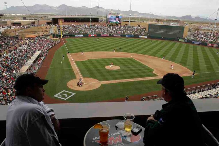 Fans watch a game between the Diamondbacks and Rockiesat their new Salt River Fields near Scottsdale, Ariz.