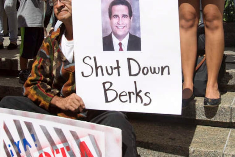 Protesters rally yesterday outside state Human Services Secretary Ted Dallas' Philadelphia office on September 14, 2015, pressuring him to revoke the license of the Berks County Residential Center, an immigrant detention center.